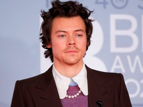 FILE: British singer-songwriter Harry Styles poses on the red carpet on arrival for the BRIT Awards 2020 in London on Feb. 18, 2020.