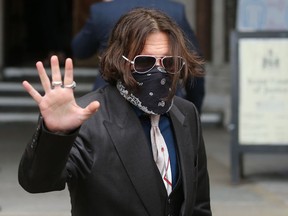 Actor Johnny Depp arrives wearing a face covering due to the COVID-19 pandemic, on the second day of his libel trial against News Group Newspapers (NGN), at the High Court in London, on July 8, 2020. Photo: Isabel Infantes / AFP / Getty Images