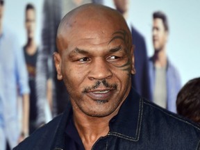 FILE: Former boxer Mike Tyson poses on arrival for the premiere of the film "Entourage" in Los Angeles, Calif. on June 1, 2015. /
