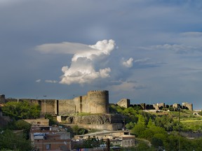 Photo of Diyarbakır, Turkey's historical walls and Hevsel gardens by by sonmez/Getty Images