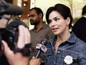 FILE: Actress Karen Duffy speaks to members of the press during a rally at Lincoln Plaza Cinemas to support Michael Moore's new documentary "Fahrenheit 9/11" on June 30, 2004 in New York City.