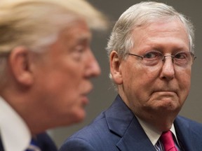 US President Donald Trump speaks alongside Senate Majority Leader Mitch McConnell (R), as they hold a meeting about tax reform in the Roosevelt Room of the White House in Washington, DC, September 5, 2017.