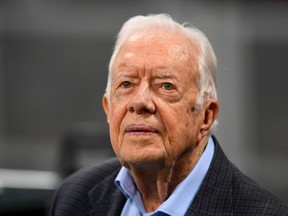 Former president Jimmy Carter prior to the game between the Atlanta Falcons and the Cincinnati Bengals at Mercedes-Benz Stadium on September 30, 2018 in Atlanta, Georgia.