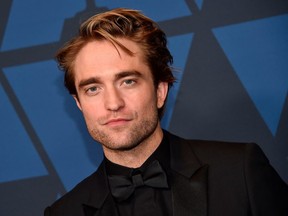 FILE: British actor Robert Pattinson arrives to attend the 11th Annual Governors Awards gala hosted by the Academy of Motion Picture Arts and Sciences at the Dolby Theater in Hollywood on Oct. 27, 2019.