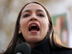 FILE: Rep. Alexandria Ocasio-Cortez (D-NY) speaks during a news conference to introduce legislation to transform public housing as part of her Green New Deal outside the U.S. Capitol Nov. 14, 2019 in Washington, DC. /