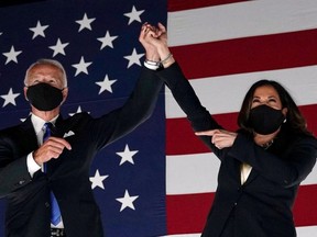 FILE: Former vice-president and Democratic presidential nominee Joe Biden (L) and Senator from California and Democratic vice presidential nominee Kamala Harris greet supporters outside the Chase Center in Delaware at the conclusion of the Democratic National Convention, held virtually amid the novel coronavirus pandemic, on Aug. 20, 2020.