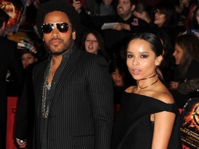 Lenny Kravitz and his daughter Zoe arrive for the Los Angeles premiere of "The Hunger Games: Catching Fire" at the Nokia Theatre LA Live in Los Angeles, California, November 18, 2013.