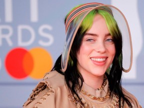 FILE: U.S. singer-songwriter Billie Eilish poses on the red carpet on arrival for the BRIT Awards 2020 in London on Feb. 18, 2020.