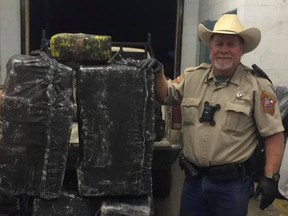 When the vehicle was searched, the police discovered six large marijuana bales. /