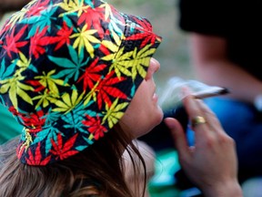 FILE: An Israeli smokes a marijuana joint in Jerusalem on Apr. 20, 2017 during a rally at the Rose garden, to celebrate 420 and to express their defiance of current laws.