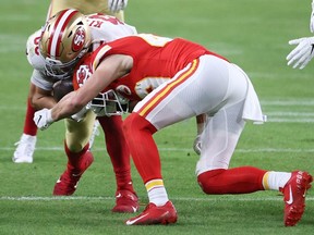 FILE: George Kittle #85 of the San Francisco 49ers is tackled by Daniel Sorensen #49 of the Kansas City Chiefs after a catch in Super Bowl LIV at Hard Rock Stadium on Feb. 02, 2020 in Miami, Fla. /
