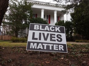 FILE: A Black Lives Matter sign sits in front of a home on Mar. 23, 2021 in Evanston, Ill. The City Council of Evanston voted yesterday to approve a plan, which may be the first of its kind in the nation, to make reparations available to Black residents due to past discrimination. /