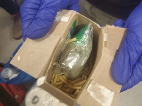 Bags of illicit cannabis located inside box of KD. /