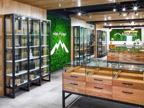 Some of the store's interior design elements include suspended wooden features, moss walls and custom display cases.