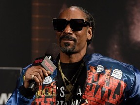 FILE: Rapper Snoop Dogg speaks during a news conference for Triller Fight Club's inaugural 2021 boxing event at The Venetian Las Vegas on Mar. 26, 2021 in Las Vegas, Nev. /