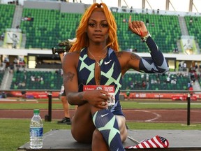 Sha'Carri Richardson raises her fist after winning the Women's 100 Meter final on day 2 of the 2020 U.S. Olympic Track & Field Team Trials at Hayward Field on June 19, 2021 in Eugene, Oregon.