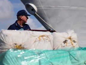 FILE: Vice Adm. Steven Poulin, Atlantic Area Commander, U.S. Coast Guard, speaks to the media near the Cutter James about the drugs offloaded at Port Everglades on Aug. 05, 2021 in Port Everglades, Fla. /