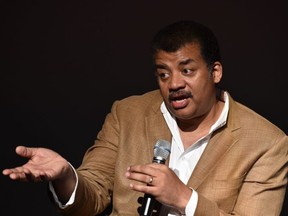 Neil deGrasse Tyson, astrophysicist, "Cosmos" television show host and Frederick P. Rose Director of the Hayden Planetarium at the American Museum of Natural History speaks August 4, 2014 after a screening of James Cameron's "Deepsea Challenge 3D" film at the museum in New York.