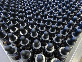 FILE: A batch of CBD tinctures awaits final inspection at High Purity Natural Products' facility. /