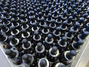 A batch of CBD tinctures awaits final inspection at High Purity Natural Products' facility. /