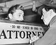 Robert Mitchum, who served 50 days in jail on a marijuana conviction, talks with attorney Jerry Geisler about his release on March 29, 1949.
