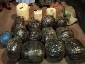 The authorities 13 bales of cannabis and 35 litres of locally distilled Chang’aa brew. /