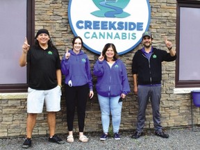 Four staff members at Creekside Cannabis on Mississauga First Nation were out on Sept. 25 celebrating one year in business.  They are Tony Chiblow, Julia Horton, Tanya Bennett and Paul Corbiere. /