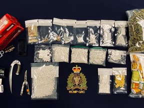 Police found what they believe to be methamphetamine, ecstasy, hydromorphone and oxycodone pills, psilocybin mushrooms, prescription pills, contraband cigarettes and cannabis, prohibited weapons, drug paraphernalia and money. /