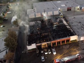 A video screen capture of an aerial view of fire scene. /