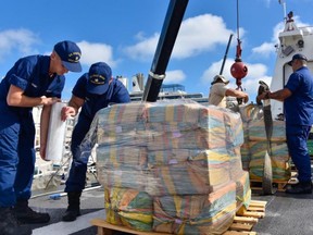 Coast Guard Cutter Hamilton’s crew wraps bails at Port Everglades, Fla. on Nov. 22, 2021. /