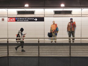 FILE: People walk along the Second Avenue subway station on November 09, 2021 in New York City. /
