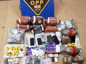 Man and teen charged after contraband found.