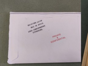 A seized envelop sent to a correctional facility that contained some drug-soaked paper. /