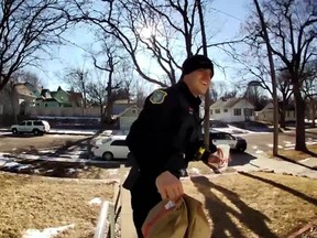 Screen capture of officer approaching South Dakota home to complete food delivery. /