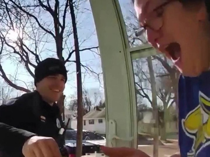  Video screen capture of customer’s response after officer hands her the food delivery. /