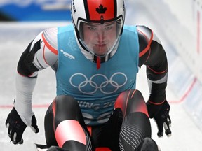 Canada's Reid Watts takes part in the men's singles luge training session at the Yanqing National Sliding Centre in Yanqing on Feb. 3, 2022, ahead of the Beijing 2022 Winter Olympic Games. /