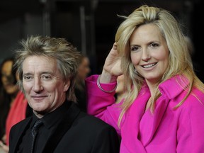 FILE - British singer Rod Stewart (L) and his wife, English model and photographer Penny Lancaster, arrive to attend The Royal Film Performance Hugo, in London, England on November 28, 2011.