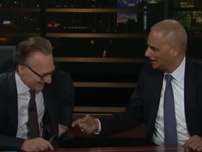 Screen grab of video of Bill Maher laughing it up as he and Eric Holder discuss smoking weed. /