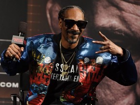 FILE: Rapper Snoop Dogg attends a news conference for Triller Fight Club's inaugural 2021 boxing event at The Venetian Las Vegas on Mar. 26, 2021 in Las Vegas, Nev. /