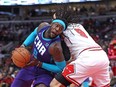 FILE: Montrezl Harrell #8 of the Charlotte Hornets drives around Nikola Vucevic #9 of the Chicago Bulls at the United Center on April 08, 2022 in Chicago, Ill. /