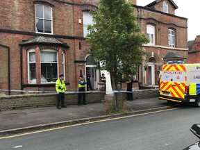 Police standing outside home where large cannabis grow was discovered this week. /