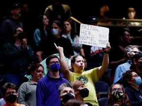 FILE: A fan holds a sign for Brittney Griner, who has been detained in Russia for 99 days since February 17, during the fourth quarter between the Seattle Storm and the New York Liberty at Climate Pledge Arena on May 27, 2022 in Seattle, Washington.