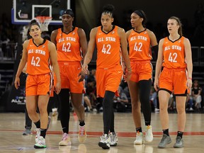 FILE: Members of Team Wilson wear Brittney Griner's number while they walk to the bench during the 2022 AT&T WNBA All-Star Game at the Wintrust Arena on July 10, 2022 in Chicago, Ill. /