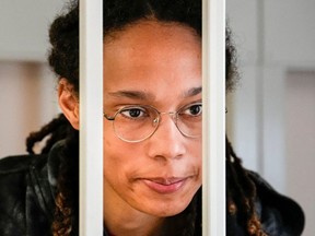 FILE: US WNBA basketball superstar Brittney Griner looks from inside a defendants' cage before a hearing at the Khimki Court, outside Moscow on July 26, 2022. /