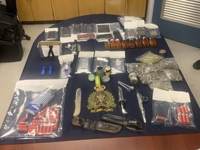 Item seized by the RCMP include ammunition, knives, bottles of pills, bags of illicit cannabis and various electronic devices, including cell phones, digital scales and a tablet.