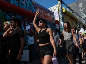 People march together to protest the Supreme Court's decision in the Dobbs v Jackson Women's Health case on June 24, 2022 in Miami, Florida.