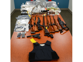 A London man faces multiple charges after police seized 10 guns, a prohibited silencer and a large quantity of cannabis from a London home on Aug. 3, 2022 the Royal Canadian Mounted Police said. (RCMP photo)