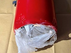 Police photo of fire extinguisher stuffed with cannabis. /