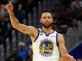 FILE: Stephen Curry #30 of the Golden State Warriors controls the ball as he brings it up court during the 1st half of the game against the Los Angeles Lakers at Chase Center on Oct. 18, 2022 in San Francisco, Calif. /