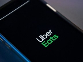 FILE: A photograph arranged as an illustration in Brenchley, south-east England on Aug. 18, 2020 shows the Uber Eats app on a smart phone. /